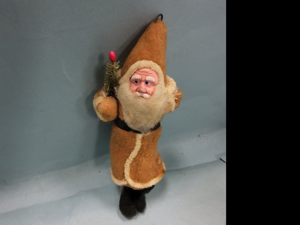 Cotton body clay face Santa ornament with tree. 