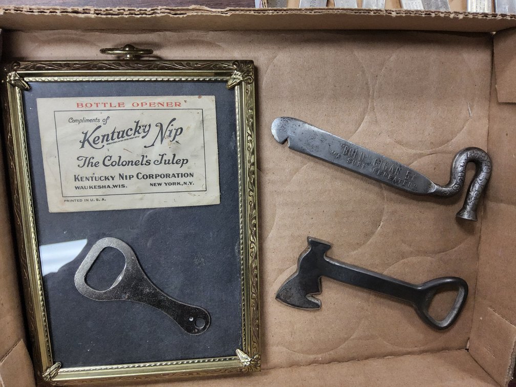 Advertising bottle openers and cigar box knives.