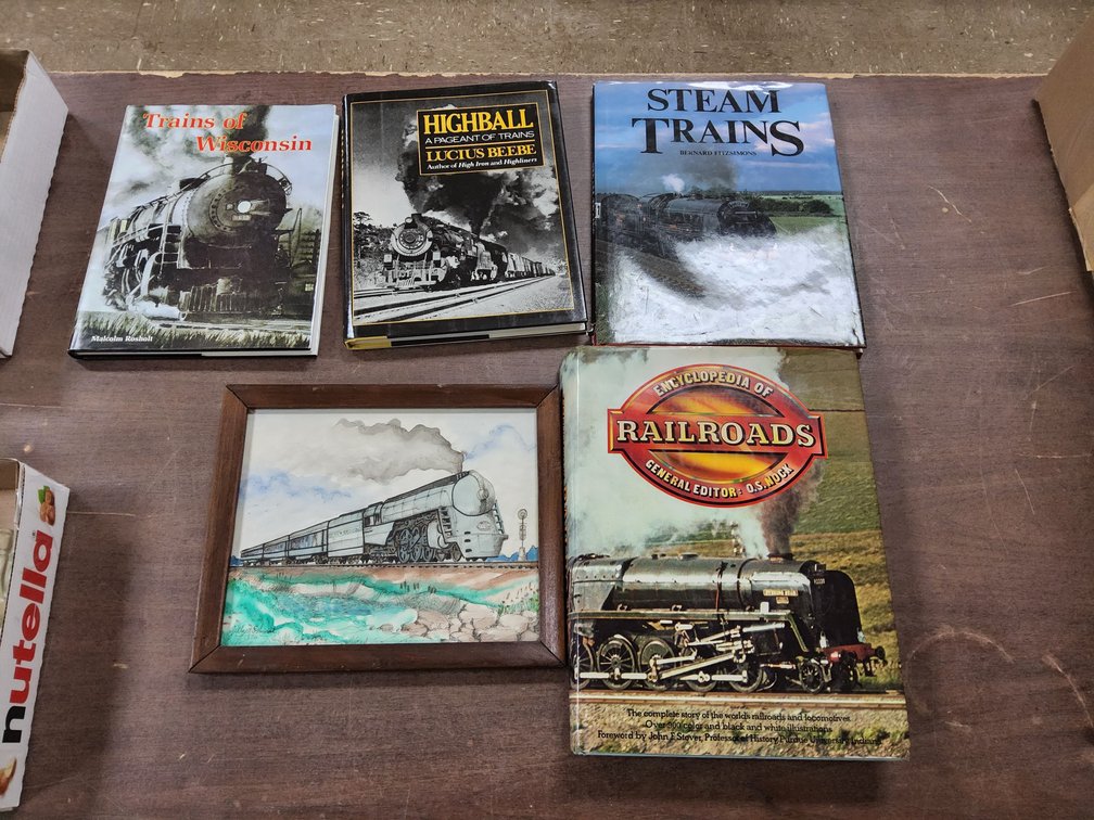 Train related books and a Gilbert Schmidt watercolor.
