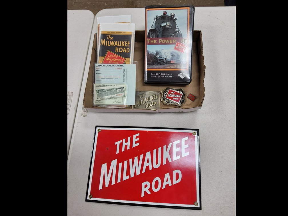 Milwaukee Road porcelain sign, passes, tickets, belt buckles, schedules, et cetera