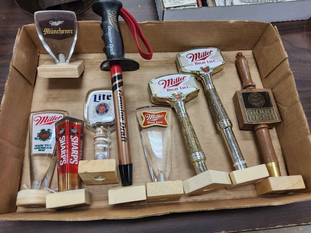 9 Miller beer product tap handles.