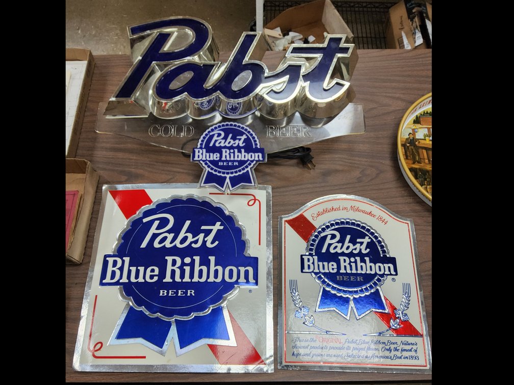 Lighted Pabst sign and two foil over paperboard signs