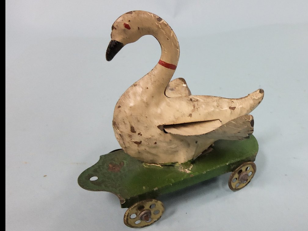 Stamped tin German pull toy of flapping wing goose 