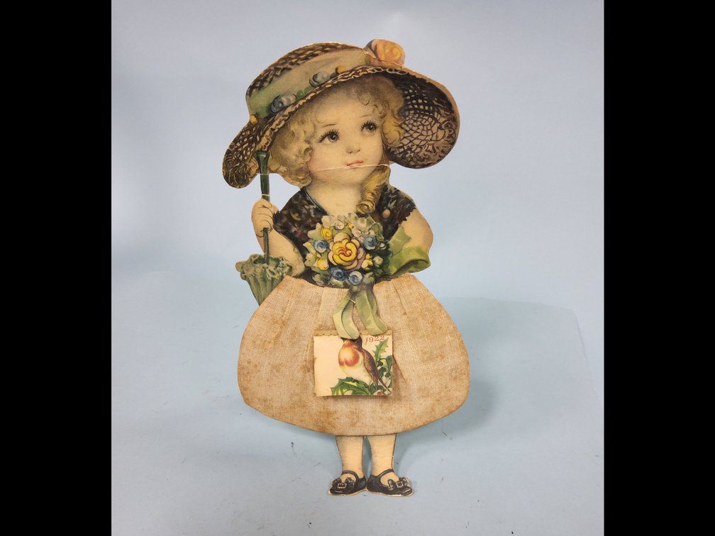 Die Cut 1922 stand up calendar girl with cloth skirt