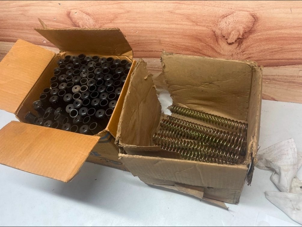 Box of springs and a box of handle caps.