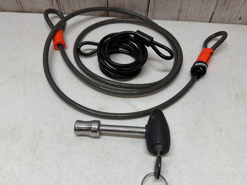 Security cables and hitch lock