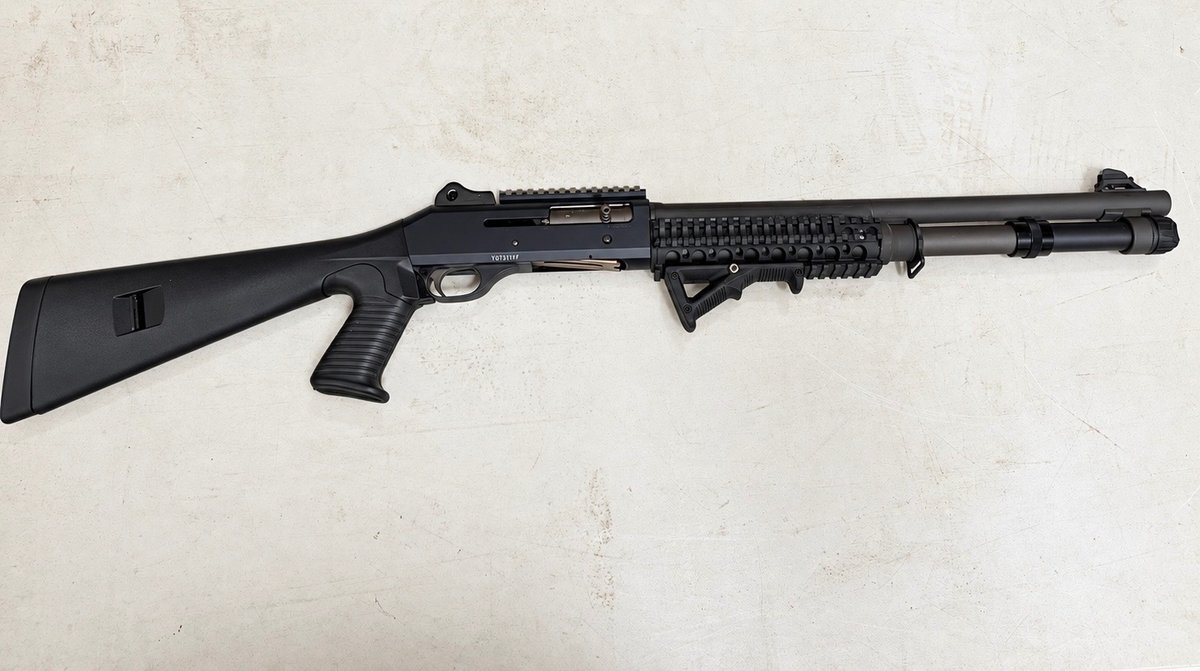 Benelli M4 12g with Sure Fire front rails and forward grip
