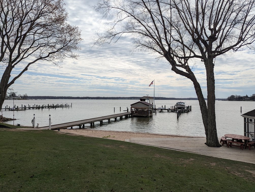 Image for LARGE WATERFRONT PROPERTY/ 2-STORY CONTEMP. HOME W/ ATT. 2-CAR GARAGE & 1-BR COTTAGE HOME/(4) PARCELS TOTALING 3.35 +/- AC SOLD IN THE ENTIRETY/ 155' FT FRONTAGE ON BUSH RIVER W SANDY BEACH/ LARGE DOCK W/ (10) +/- BOAT SLIPS, TIKI BAR & MORE!