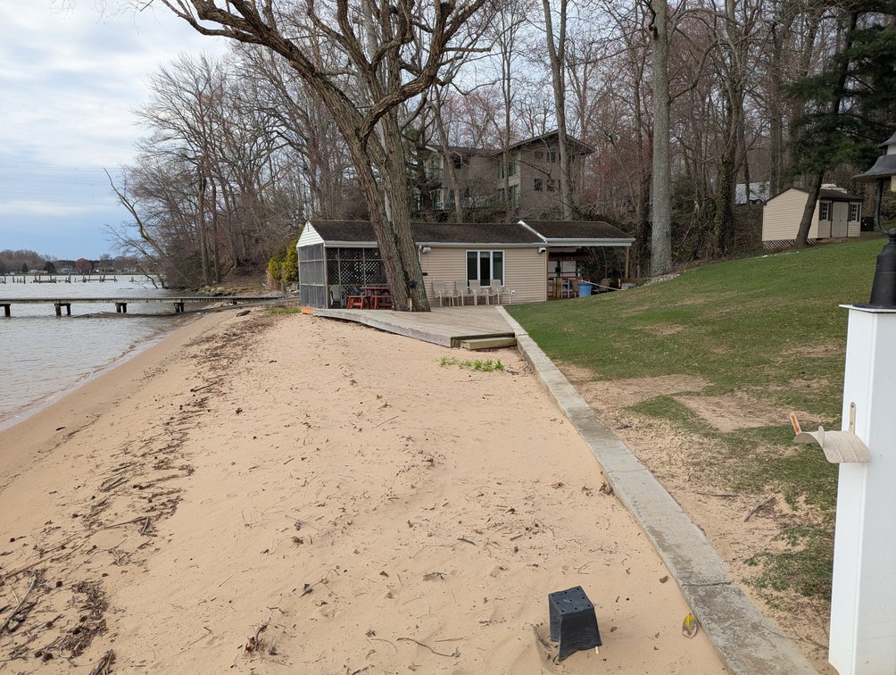 Image for LARGE WATERFRONT PROPERTY/ 2-STORY CONTEMP. HOME W/ ATT. 2-CAR GARAGE & 1-BR COTTAGE HOME/(4) PARCELS TOTALING 3.35 +/- AC SOLD IN THE ENTIRETY/ 155' FT FRONTAGE ON BUSH RIVER W SANDY BEACH/ LARGE DOCK W/ (10) +/- BOAT SLIPS, TIKI BAR & MORE!
