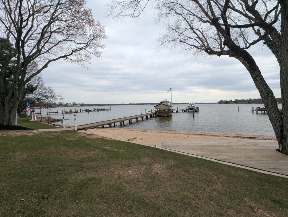 Image for LARGE WATERFRONT PROPERTY/ 2-STORY CONTEMP. HOME W/ ATT. 2-CAR GARAGE & 1-BR COTTAGE HOME/(4) PARCELS TOTALING 3.35 +/- AC SOLD IN THE ENTIRETY/ 155' FT FRONTAGE ON BUSH RIVER W SANDY BEACH/ LARGE DOCK W/ (10) +/- BOAT SLIPS, TIKI BAR & MORE!