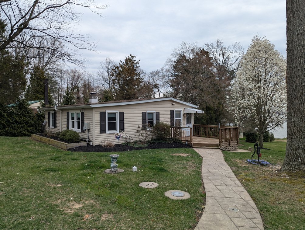 Image for LARGE WATERFRONT PROPERTY/ 2-STORY CONTEMP. HOME W/ ATT. 2-CAR GARAGE & 1-BR COTTAGE HOME/(4) PARCELS TOTALING 3.35 +/- AC SOLD IN THE ENTIRETY/ 155' FT FRONTAGE ON BUSH RIVER W SANDY BEACH/ LARGE DOCK W/ (10) +/- BOAT SLIPS, TIKI BAR & MORE!