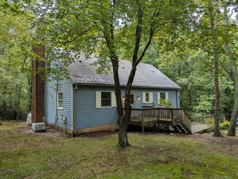 Image for 2-STORY ALUMINUM SIDED HOME W/ 2-CAR GARAGE ON 1.5 +/- ACRE PRIVATE WOODED LOT