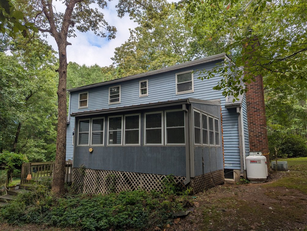 Image for 2-STORY ALUMINUM SIDED HOME W/ 2-CAR GARAGE ON 1.5 +/- ACRE PRIVATE WOODED LOT