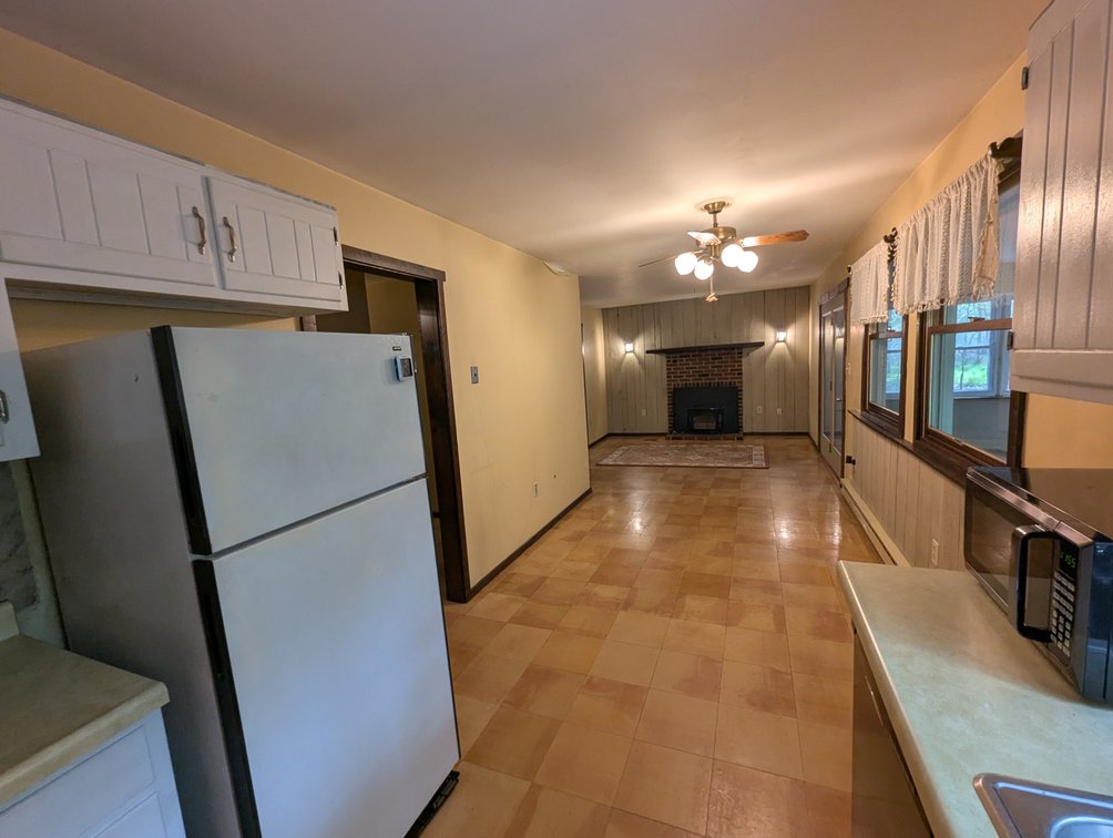 Image for 2-STORY ALUMINUM SIDED HOME W/ 2-CAR GARAGE ON 1.5 +/- ACRE PRIVATE WOODED LOT