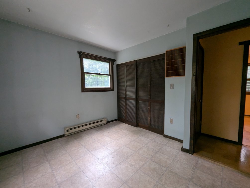 Image for 2-STORY ALUMINUM SIDED HOME W/ 2-CAR GARAGE ON 1.5 +/- ACRE PRIVATE WOODED LOT