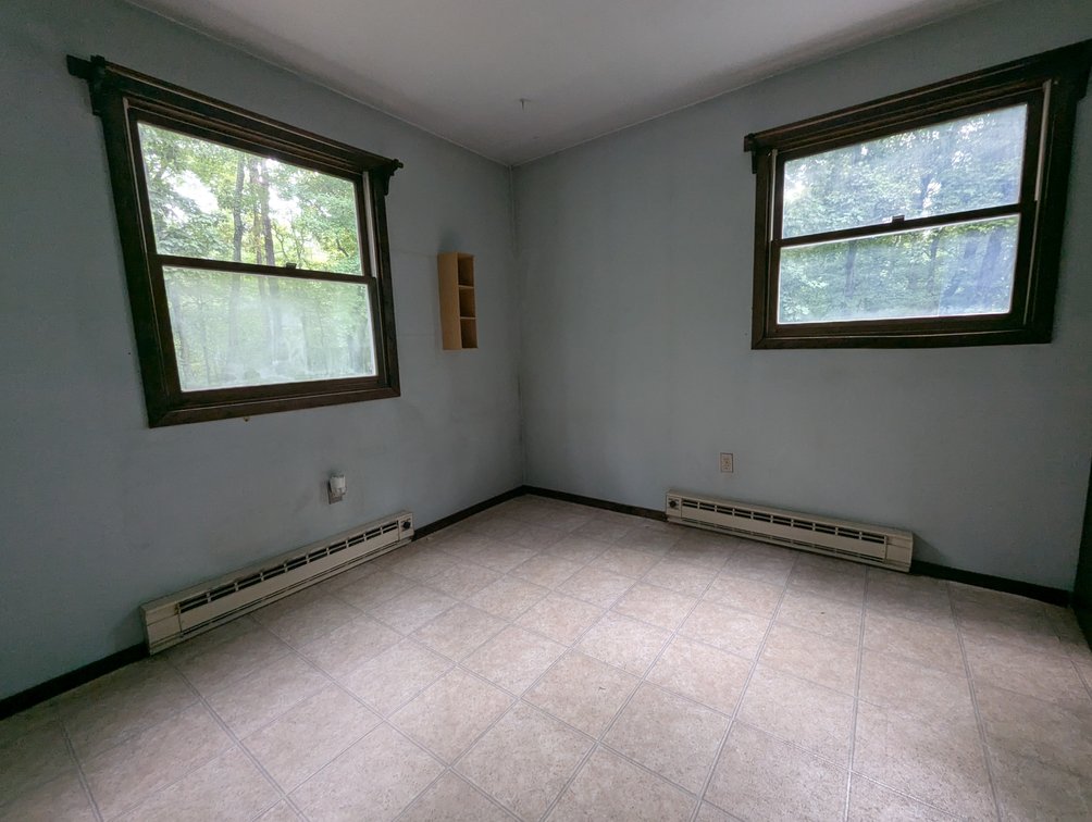Image for 2-STORY ALUMINUM SIDED HOME W/ 2-CAR GARAGE ON 1.5 +/- ACRE PRIVATE WOODED LOT