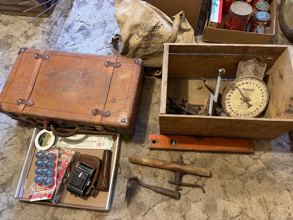 leather suit case, carpenter tools,  level, camera