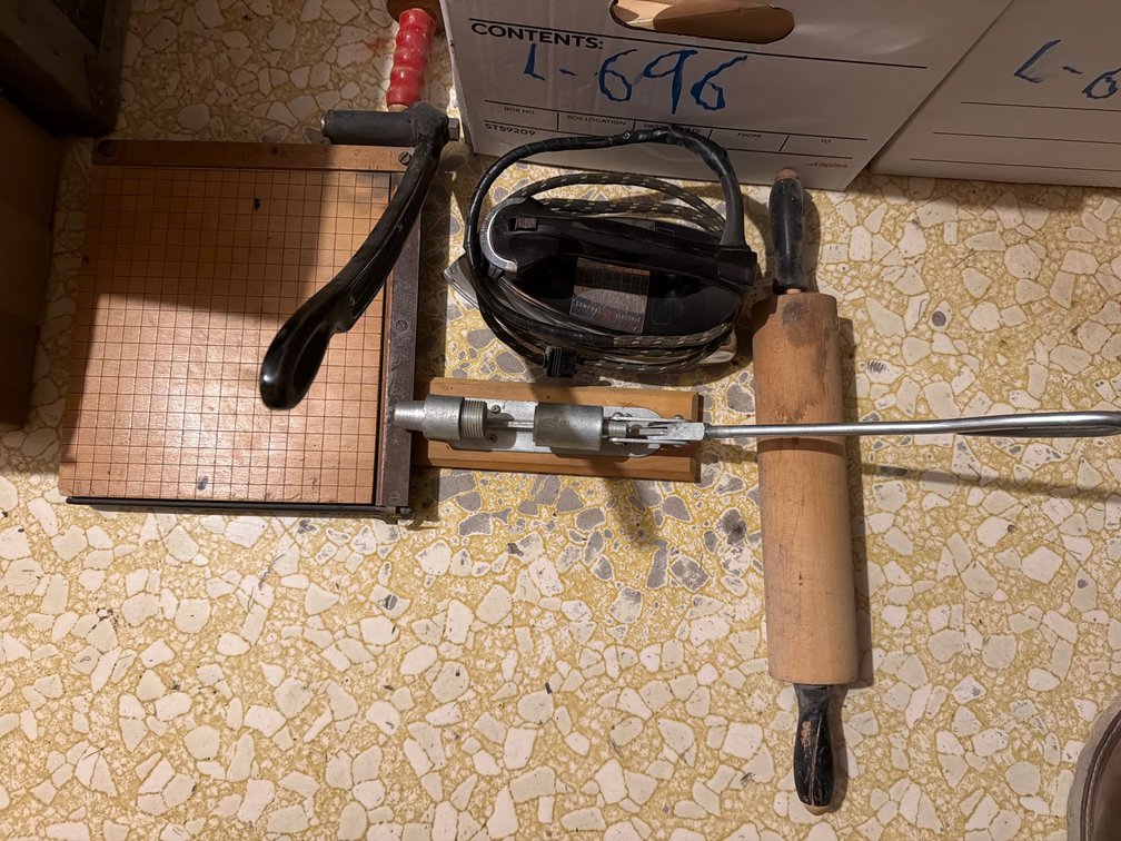 nut cracker, paper cutter,  cookie cutters, rolling pins