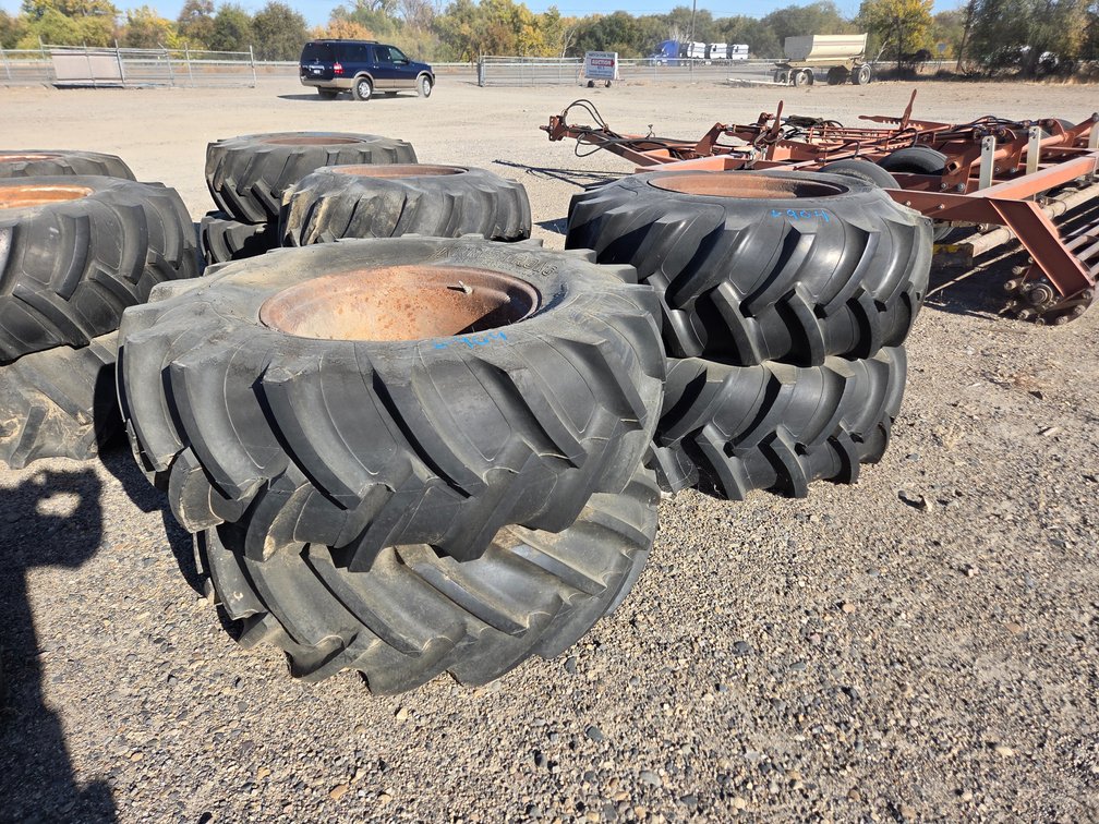 4- 16.9x24" pivot tires, 8 hole wheels