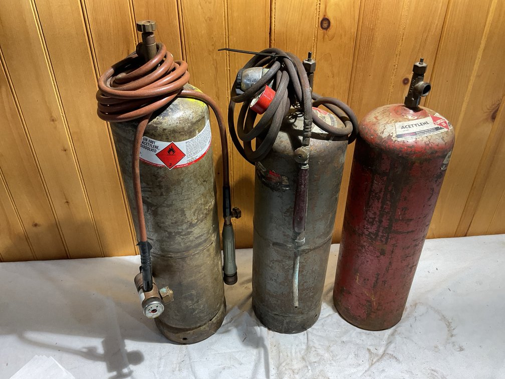 3 acetylene tanks and 2 gauges