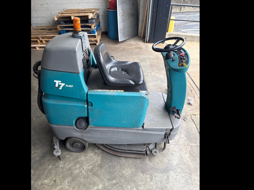 Damaged Tennant T7 FaST ride-on floor scrubber