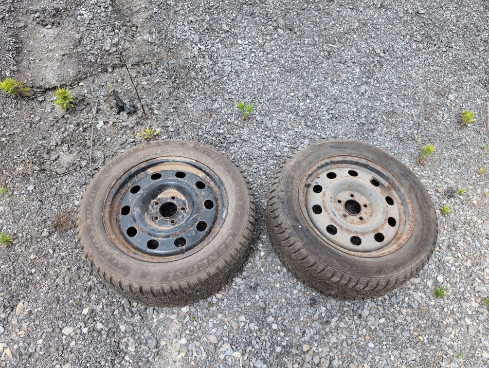 2 Studded Tires Mounted on Wheels