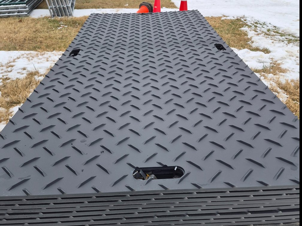 Stack of 15 ground protection mats