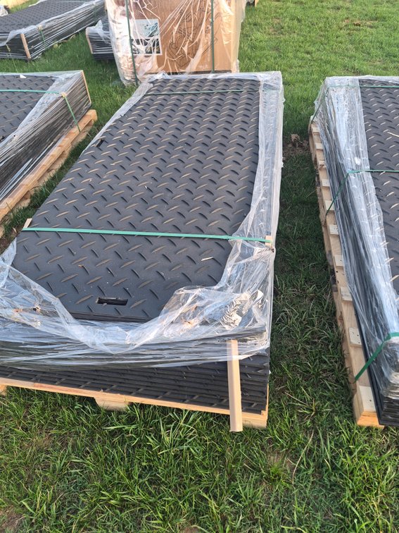 Stack of 15 ground protection mats