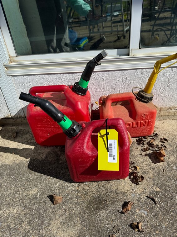 Three Red Plastic Gasoline Cans with Pour Spouts