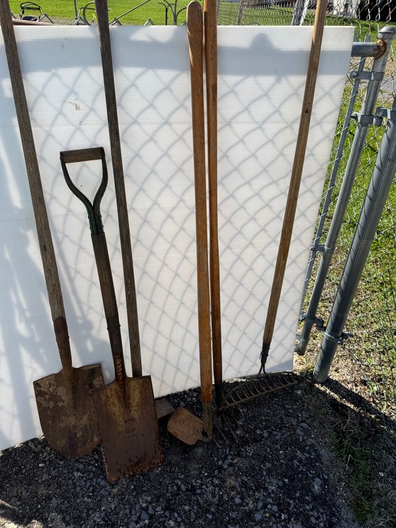Garden Tools Including Shovel, Spade, Bow Rake, and Hoes