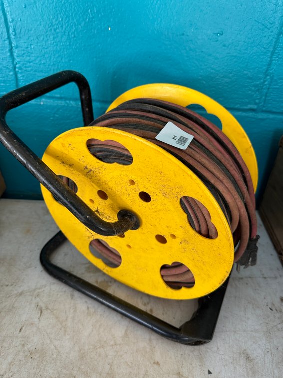 Cord Reel with Extension Cord on Metal Stand