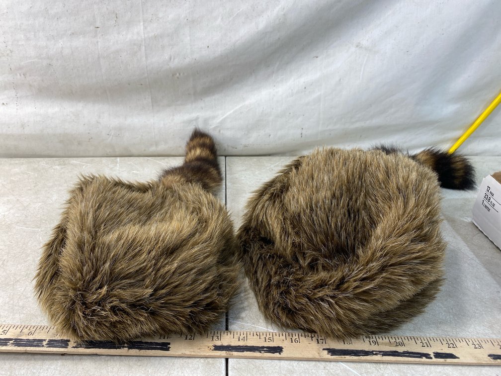 Two Coonskin-Style Fur Caps with Striped Tails
