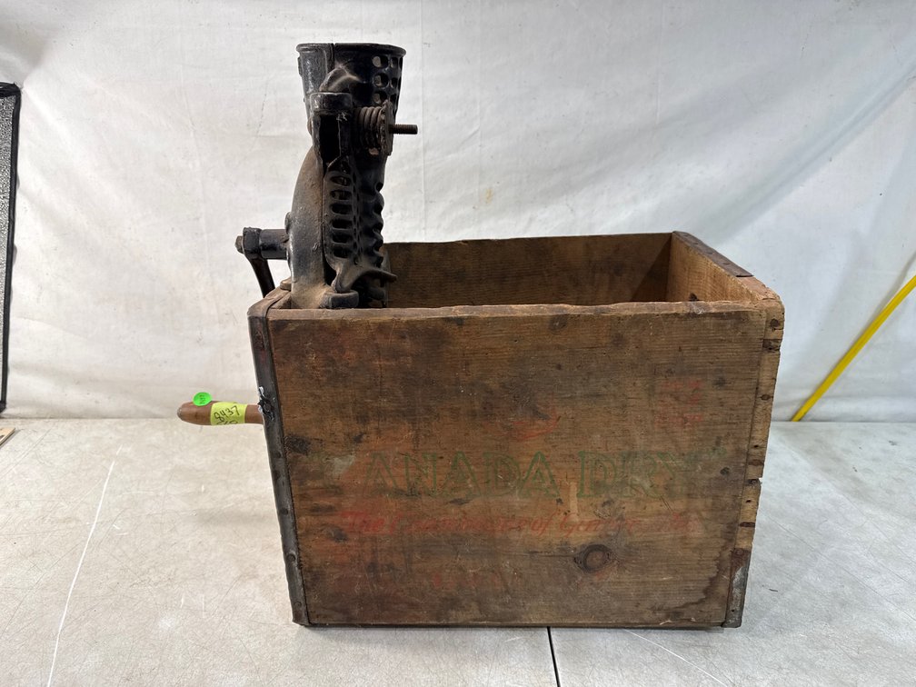 Mounted Cast Iron Grinder and Corn Sheller on Wooden Crates