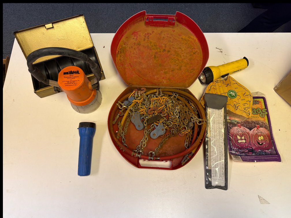 Trainman Lantern, Metal Cash Box, Tire Chain, Slide Rule, and Flashlight