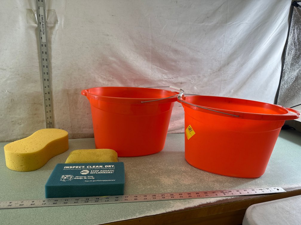 Orange Plastic Bucket and Cleaning Sponge