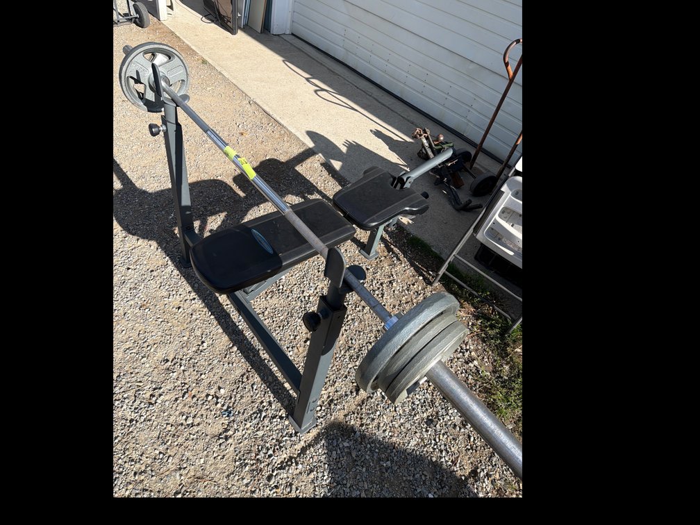 Weight Bench with Barbell and Weight Plate
