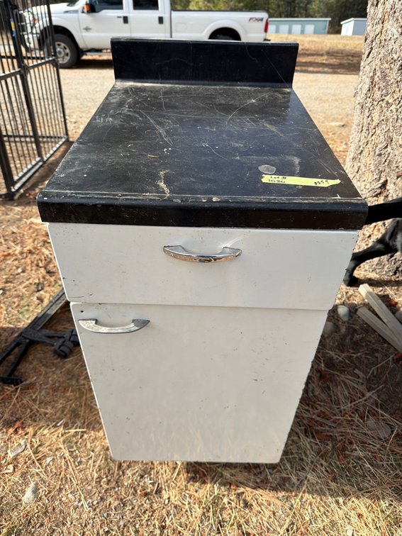 White Metal Base Cabinet with Black Countertop