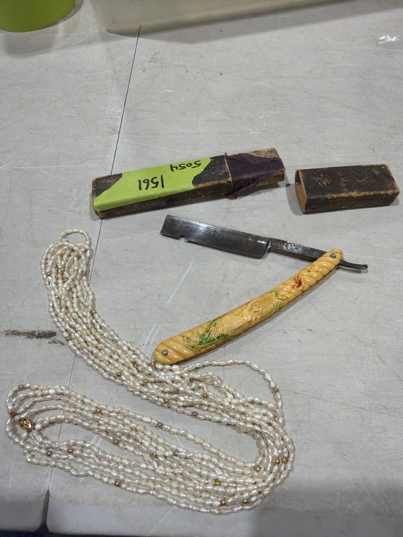 Straight Razor and Multi-Strand Pearl Necklace