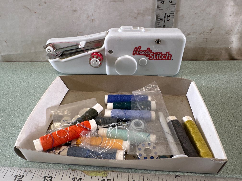 Handheld Sewing Machine with Sewing Notions