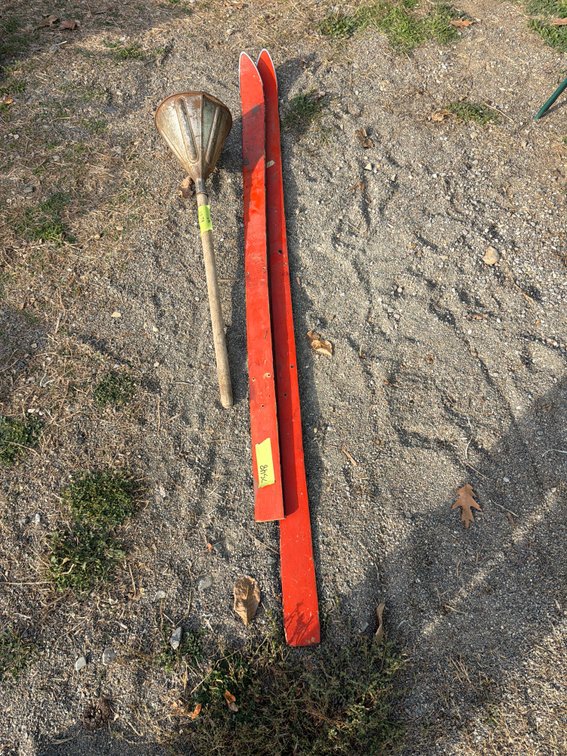 Red Wooden Ski and Metal Cone Pole Tool