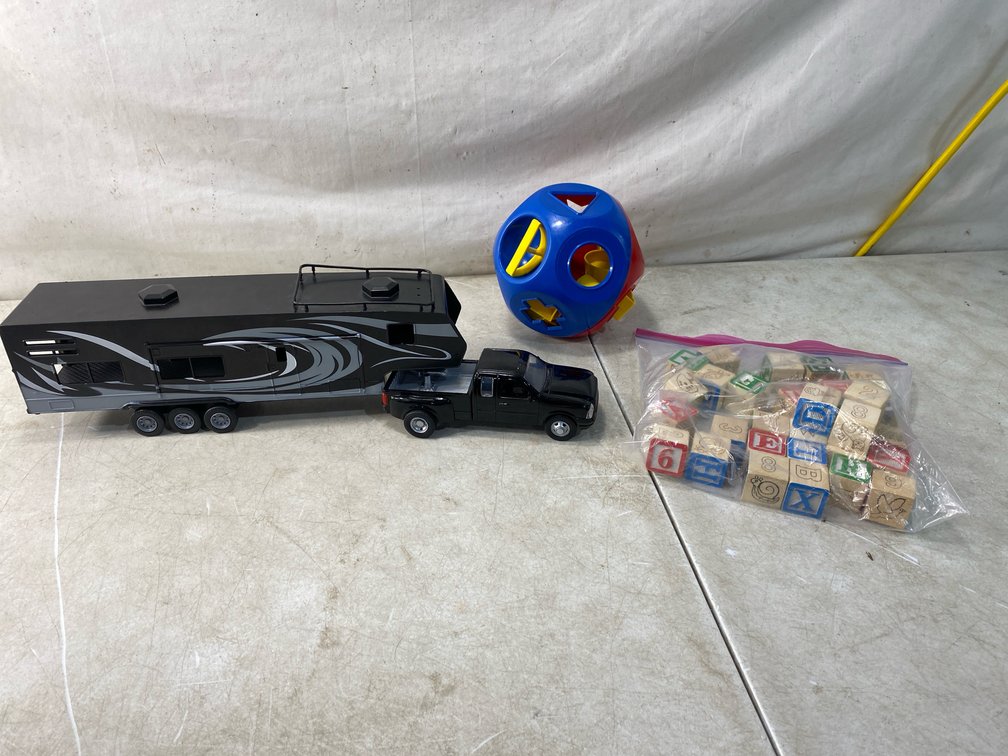 Toy Truck with Camper Trailer, Shape Sorter, and Wooden Block Set