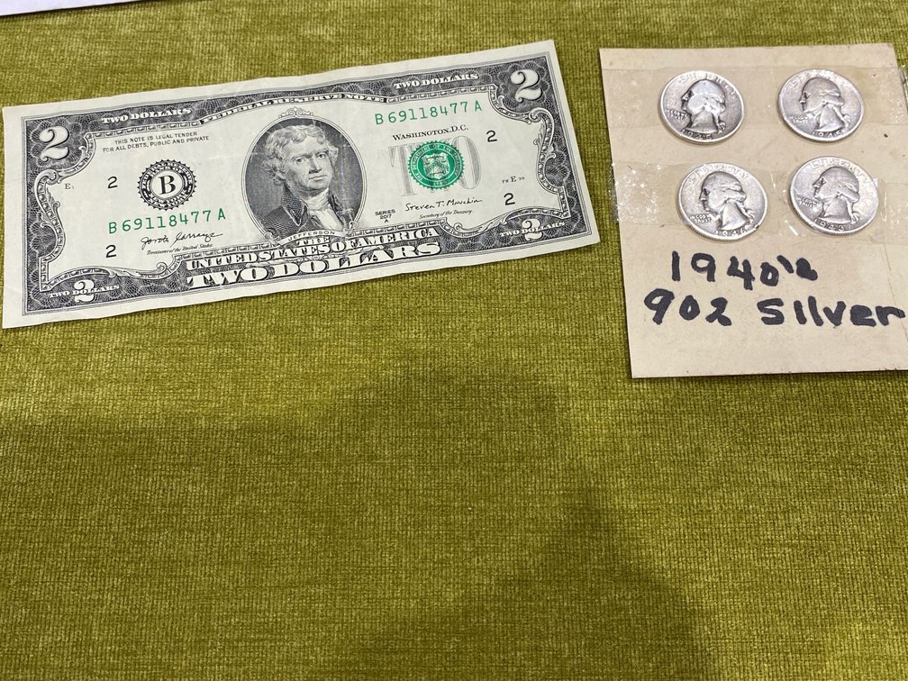 US Two-Dollar Bill and Silver Washington Quarters
