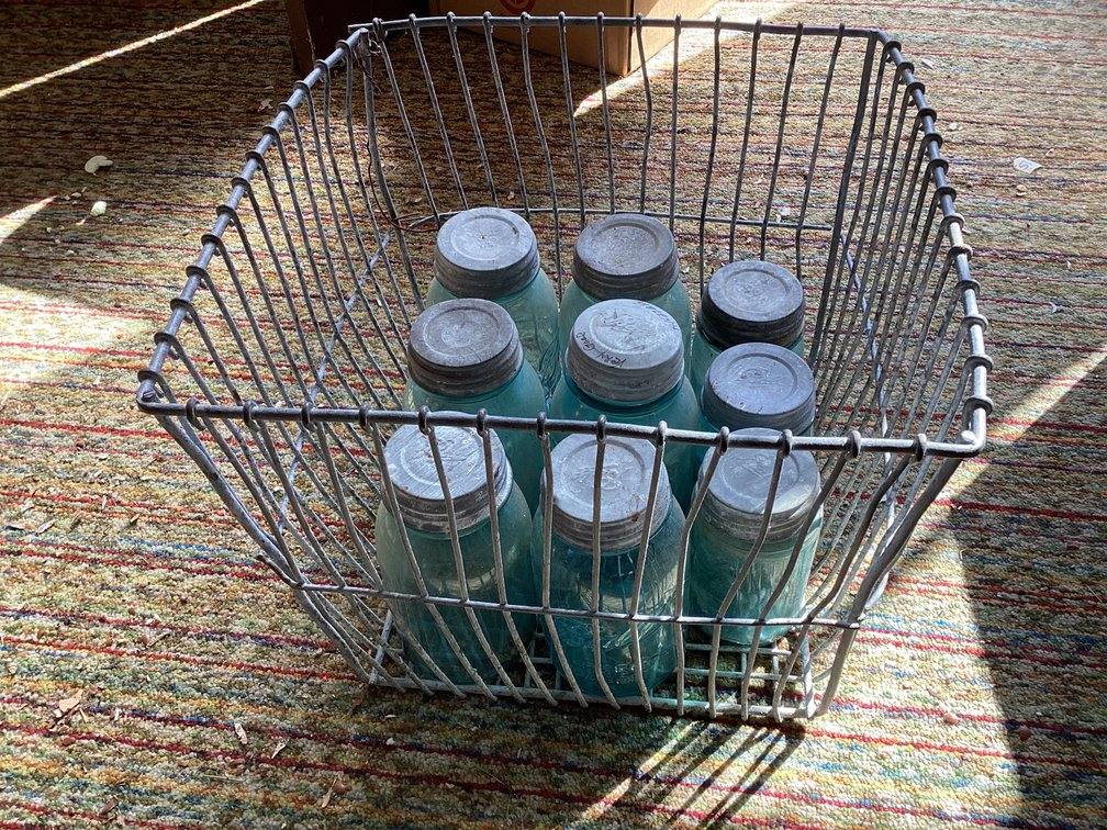 Metal crate with 9 old Ball jars