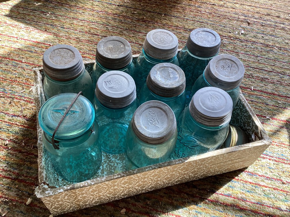 Wood crate with 8 green Ball jars