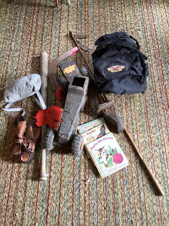 Old toys,baseball bat, hand warmer, Harley bag and books
