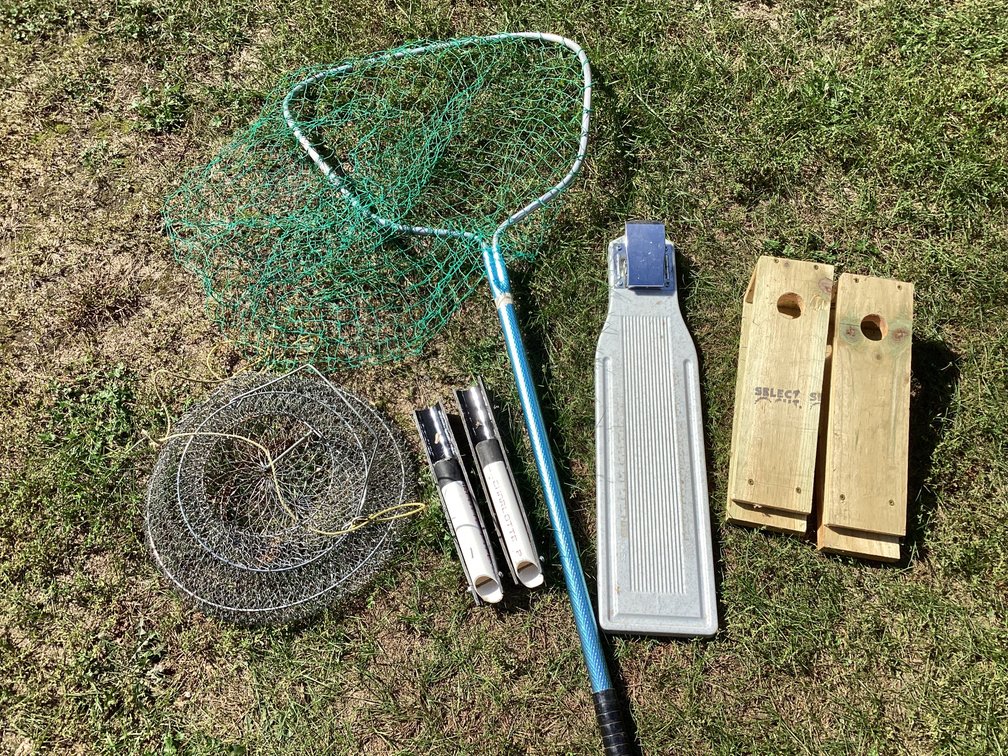 Net, home made rod holders, fish basket , filet knife and fish cleaning board