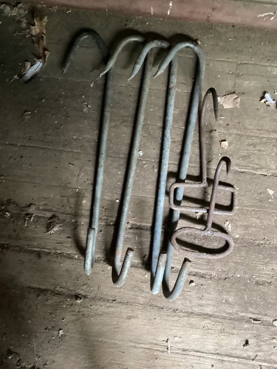 4 meat hooks and 2 hay gaffs