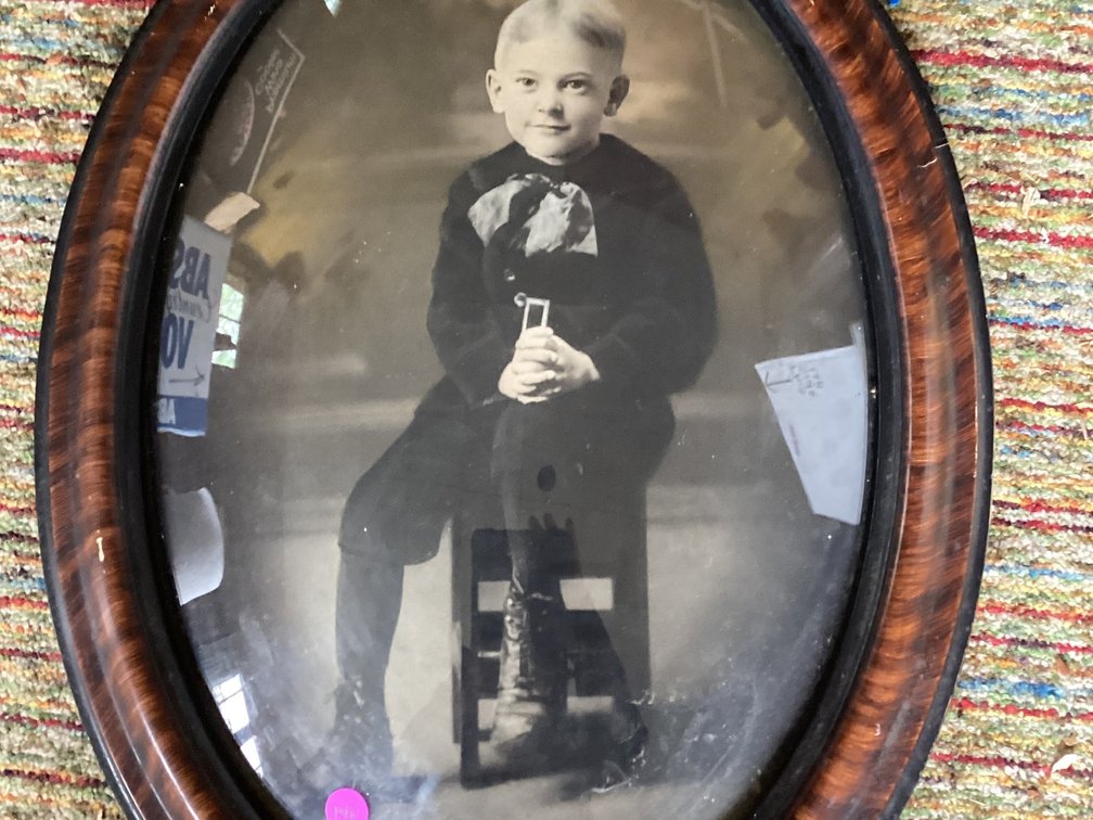 22” tall antique photograph in oval frame
