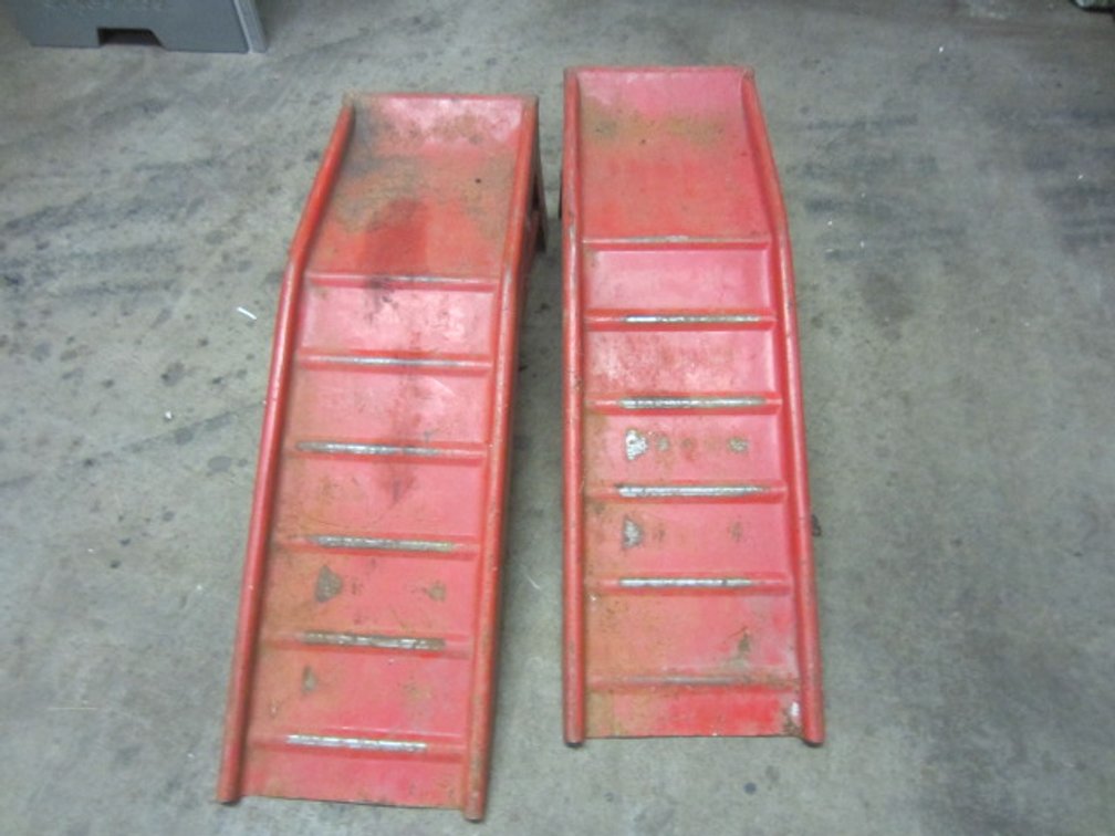 SET OF RED STEEL CAR RAMPS.