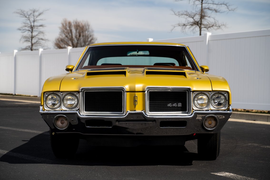 Front view of the 1971 Oldsmobile Cutlass 442 W-30 for sale from Henderson Auctions, showing its cold air induction hood and dual headlights.